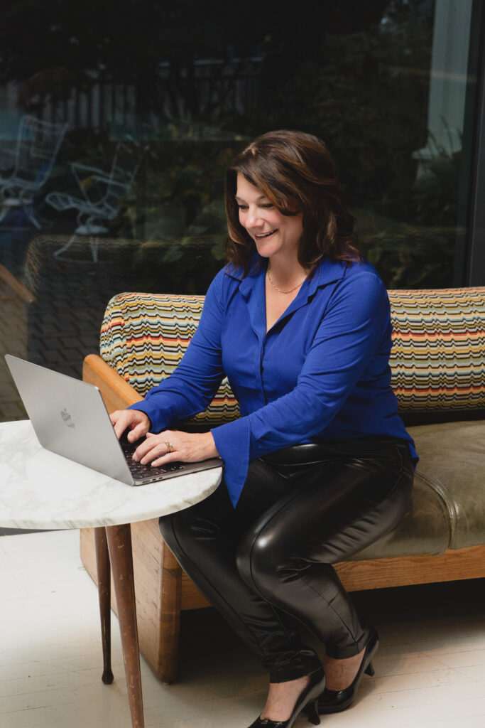 Rhonda Arnott Travel Planning with Laptop