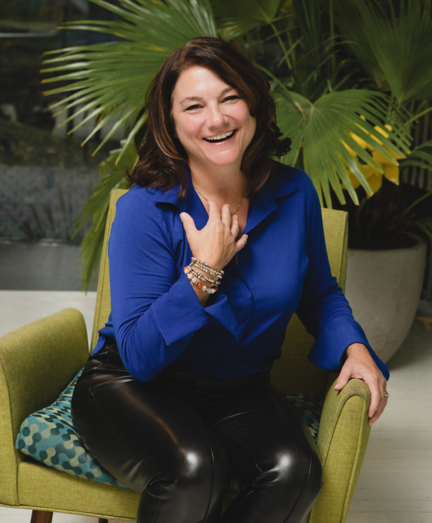 Rhonda Arnott sitting on a green chair